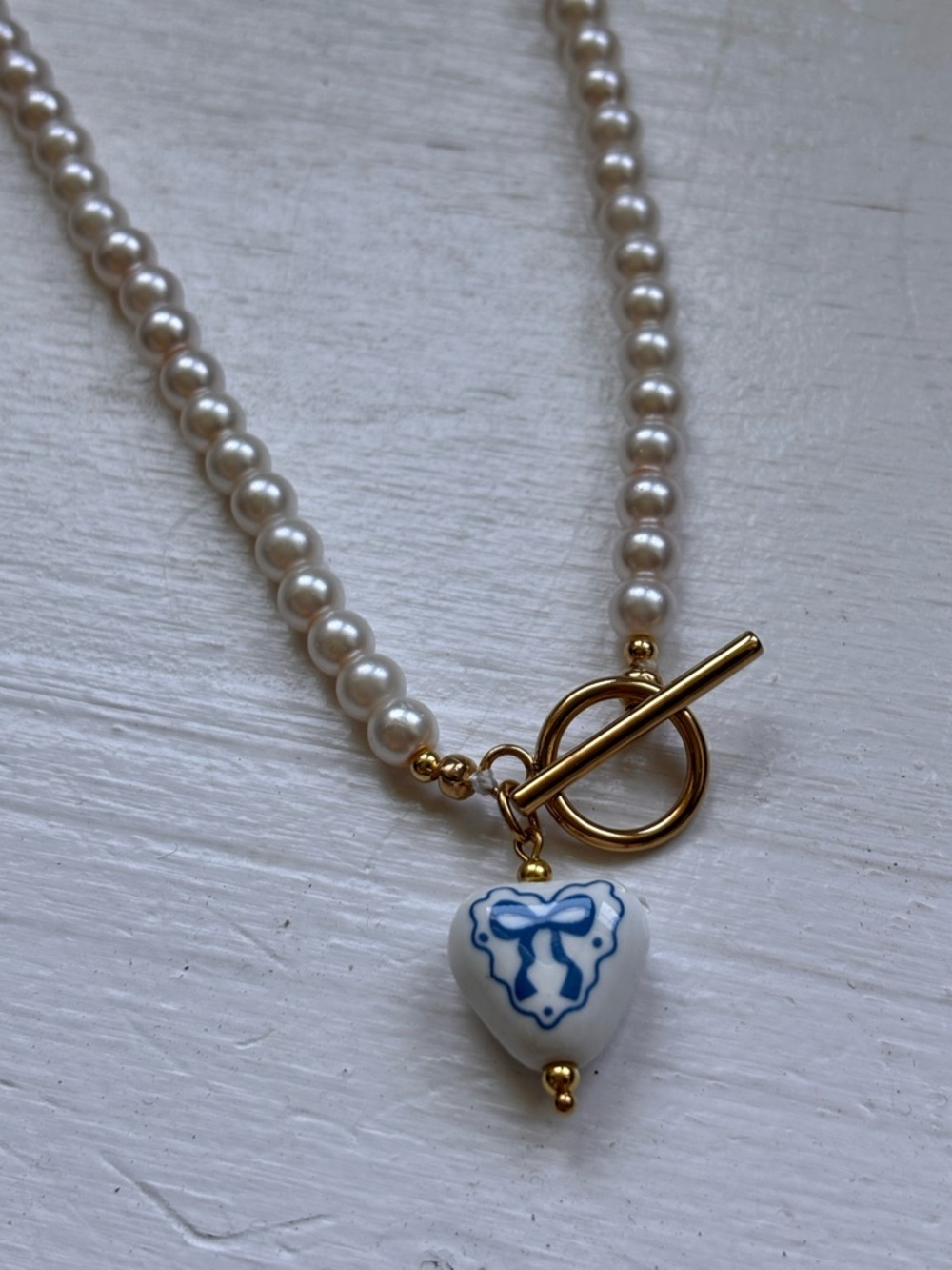 Glass Pearl Necklace with Blue and White Heart Charm - Gold Toggle
